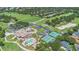 Aerial view of a community featuring a clubhouse, pool, tennis courts, and golf course at 9905 Lanai View Ct, Windermere, FL 34786