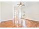 Light-filled bedroom with hardwood flooring, neutral paint, and a ceiling fan at 9905 Lanai View Ct, Windermere, FL 34786