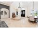 Bright dining area with a long wooden table, chairs, and stylish lighting, perfect for entertaining guests in style at 9905 Lanai View Ct, Windermere, FL 34786