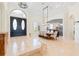 Elegant dining room with a wooden table and chandelier, creating a sophisticated space for meals and gatherings at 9905 Lanai View Ct, Windermere, FL 34786