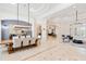 Open-concept dining and living areas with elegant lighting, dining table, and seating, promoting spaciousness at 9905 Lanai View Ct, Windermere, FL 34786
