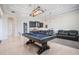 Spacious game room with a pool table, entertainment area, and custom lighting at 9905 Lanai View Ct, Windermere, FL 34786