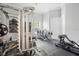 Functional home gym with weight machines, exercise equipment, and rubber flooring at 9905 Lanai View Ct, Windermere, FL 34786