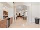 Spacious interior view with architectural columns, a kitchen bar, and multiple living areas, demonstrating the home's scale at 9905 Lanai View Ct, Windermere, FL 34786