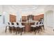 Gourmet kitchen with a large island featuring bar seating and granite countertops and custom cabinetry at 9905 Lanai View Ct, Windermere, FL 34786