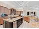 Spacious kitchen with double islands, stainless steel appliances and ample counter space, ideal for cooking at 9905 Lanai View Ct, Windermere, FL 34786