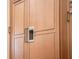 Detailed view of kitchen cabinetry with a built-in refrigerator and decorative hardware, highlighting storage solutions at 9905 Lanai View Ct, Windermere, FL 34786