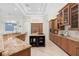 Spacious kitchen featuring granite countertops, an island cooktop, and ample cabinet space at 9905 Lanai View Ct, Windermere, FL 34786
