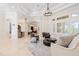 A spacious living room with large windows, offering natural light and a view of the well-designed open-concept layout at 9905 Lanai View Ct, Windermere, FL 34786