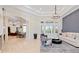 Bright living room with high ceilings, neutral paint, and elegant decor at 9905 Lanai View Ct, Windermere, FL 34786