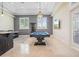 Bright recreation room features billiard table, wet bar, recessed lights and natural light from windows at 9905 Lanai View Ct, Windermere, FL 34786
