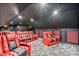 Well-appointed home theater with plush seating, a large screen, and custom design at 9905 Lanai View Ct, Windermere, FL 34786