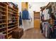 Spacious walk-in closet with custom shelving and storage solutions for organization and accessibility at 9905 Lanai View Ct, Windermere, FL 34786
