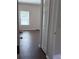 Bedroom view featuring laminate flooring, neutral walls, and closet space at 11039 Prairie Hawk Dr, Orlando, FL 32837