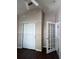 Bedroom featuring wood floors, a ceiling fan, closet, and glass panel french doors that enhance natural light and open feel at 11039 Prairie Hawk Dr, Orlando, FL 32837