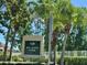 Community sign for Big Hawk Park framed by palm trees and manicured landscaping at 11039 Prairie Hawk Dr, Orlando, FL 32837