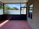 Relaxing screened-in patio providing a peaceful outdoor space with views of the fenced backyard and greenery at 11039 Prairie Hawk Dr, Orlando, FL 32837