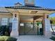 Entrance to the community pool area featuring clear signage and secure gated access at 11039 Prairie Hawk Dr, Orlando, FL 32837