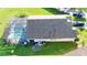 The aerial view showcases a screened-in pool and well-manicured landscaping, perfect for enjoying outdoor living at 1014 Prey Ct, Kissimmee, FL 34746