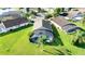 Aerial view of a home showcasing a screened-in pool and manicured lawn at 1014 Prey Ct, Kissimmee, FL 34746