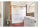 Shower stall with glass doors and decorative tiles at 1014 Prey Ct, Kissimmee, FL 34746
