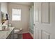 Bathroom with a shower/tub combination, a granite counter, and a window with privacy blinds at 1014 Prey Ct, Kissimmee, FL 34746