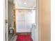 Shower stall with glass doors and decorative tiles at 1014 Prey Ct, Kissimmee, FL 34746
