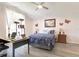 Bedroom with vaulted ceiling, a bed, a desk, cat tower and a window with lots of natural light at 1014 Prey Ct, Kissimmee, FL 34746