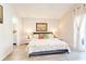Bedroom featuring a king-size bed, nightstands, and art, illuminated by table lamps at 1014 Prey Ct, Kissimmee, FL 34746
