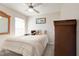 Cozy bedroom featuring a bed, a dresser and a mirror at 1014 Prey Ct, Kissimmee, FL 34746