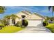 Charming single Gathering home featuring a two-car garage and well-manicured lawn at 1014 Prey Ct, Kissimmee, FL 34746