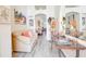 Bright living room featuring gray vinyl floors and open floor plan at 1014 Prey Ct, Kissimmee, FL 34746