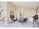 Relaxing covered patio with comfortable seating and view of the private backyard at 1014 Prey Ct, Kissimmee, FL 34746