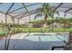 Gorgeous screened-in pool offers serene water views and an inviting outdoor space at 1014 Prey Ct, Kissimmee, FL 34746