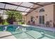 Sparkling screened-in pool surrounded by a spacious deck with comfortable seating at 1014 Prey Ct, Kissimmee, FL 34746