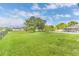 Large grassy backyard featuring ample space for recreation, gardening, or outdoor activities at 107 Whitehall Way, Kissimmee, FL 34758
