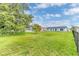 Green and spacious backyard with mature trees, great views, and ample space at 107 Whitehall Way, Kissimmee, FL 34758