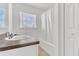 Bathroom featuring a sink, a toilet, a bathtub, and a window at 107 Whitehall Way, Kissimmee, FL 34758