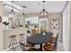 Open concept dining area with modern pendant lighting and seating for six at 107 Whitehall Way, Kissimmee, FL 34758
