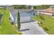Charming single-story home with a two-car garage, well-manicured lawn, and stylish landscaping at 107 Whitehall Way, Kissimmee, FL 34758