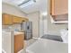 Spacious kitchen featuring stainless steel appliances and neutral countertops at 107 Whitehall Way, Kissimmee, FL 34758