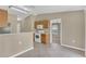 Well-lit kitchen featuring white appliances and a convenient breakfast bar at 107 Whitehall Way, Kissimmee, FL 34758