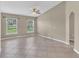Bright and airy living space with tile flooring and large windows for natural light at 107 Whitehall Way, Kissimmee, FL 34758
