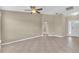 Large living room with tile flooring offers ample space and natural light at 107 Whitehall Way, Kissimmee, FL 34758