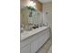 Bathroom featuring a double sink vanity, ample storage, and bright lighting at 1197 E Grove Ave, Lake Wales, FL 33853