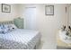 Relaxing bedroom with a queen bed, neutral walls, and closet for ample storage at 1197 E Grove Ave, Lake Wales, FL 33853