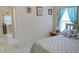 Comfortable bedroom with ample sunlight, updated bed and nice view of other parts of the home at 1197 E Grove Ave, Lake Wales, FL 33853