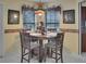 Cozy dining area featuring a round table with seating for four at 1197 E Grove Ave, Lake Wales, FL 33853