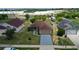 Charming single-story home featuring a well-maintained lawn and a driveway leading to an attached garage at 1197 E Grove Ave, Lake Wales, FL 33853