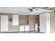 Garage area with a laundry area, shelving, and a water heater at 1197 E Grove Ave, Lake Wales, FL 33853